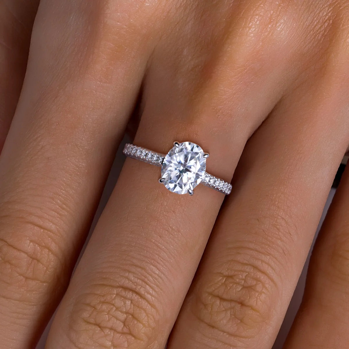 Oval moissanite solitaire top view, 3ct D color in classic prong setting — Aurora Moissanite