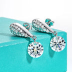 The Glow Earrings lifestyle — 6cttw moissanite drops worn — Aurora Moissanite