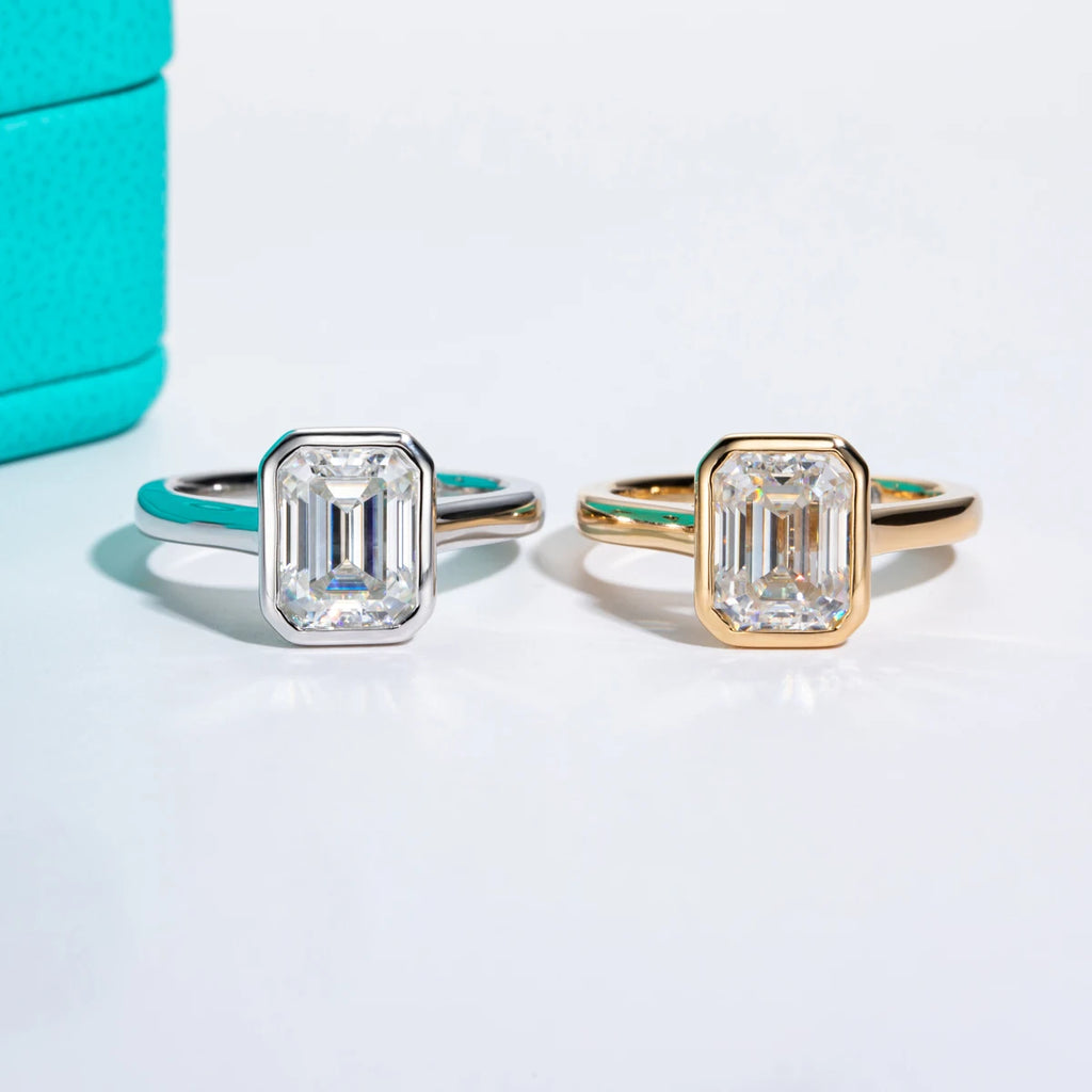 The Lyse Ring lifestyle — emerald moissanite yellow gold bezel worn on finger — Aurora Moissanite