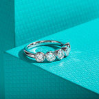 Moissanite bezel half eternity band 4mm, D color VVS1, bezel setting detail — Aurora Moissanite
