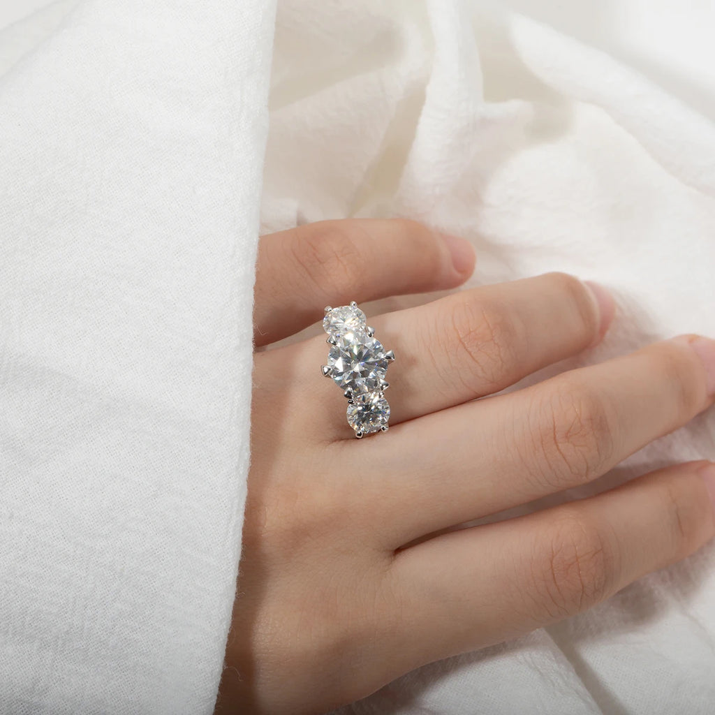 The Reas Ring worn — 5ct three-stone moissanite, rhodium plated, sizes 5–10 — Aurora Moissanite