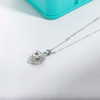 1ct heart shaped moissanite pendant, lifestyle shot, gold plated chain — Aurora Moissanite
