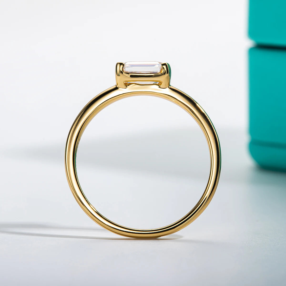 1ct emerald moissanite ring, side profile, 14K yellow gold — Aurora Moissanite