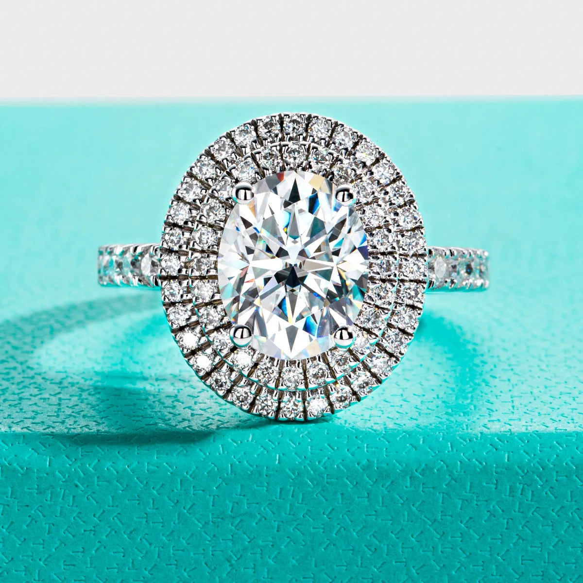 The Iris Ring worn — 3ct oval moissanite double halo, 18K gold plated — Aurora Moissanite