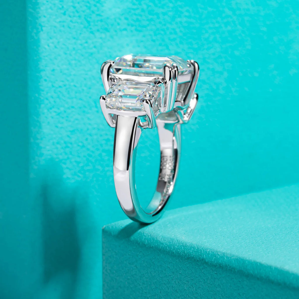 12cttw emerald moissanite 3-stone engagement ring, side profile view — Aurora Moissanite