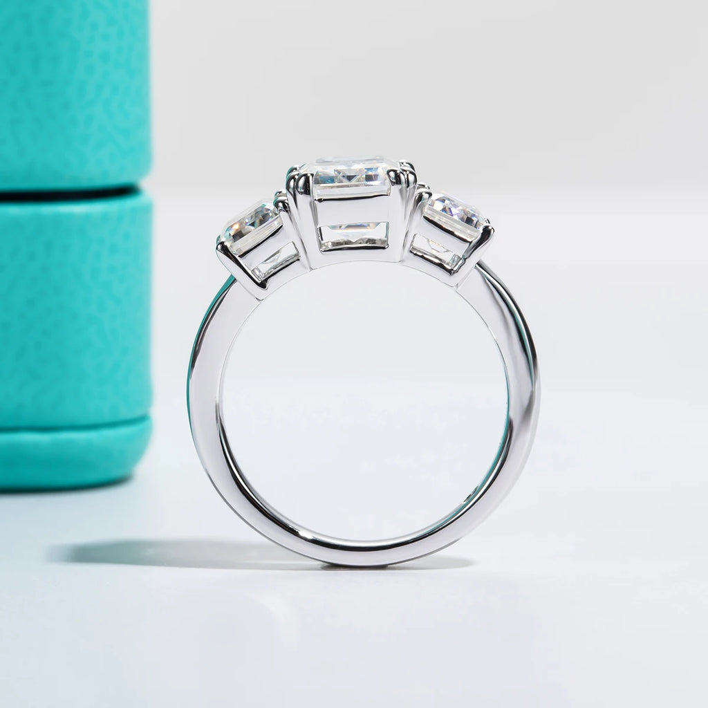 The Alva Ring lifestyle — 5cttw emerald three-stone moissanite worn on finger — Aurora Moissanite