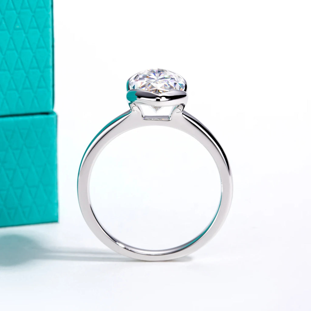 The Oryn Ring lifestyle — marquise moissanite half-bezel worn on finger — Aurora Moissanite