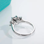 The Fen Ring — 1.6ct emerald moissanite solitaire, front view, 18K gold — Aurora Moissanite