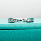 The Knot Band — moissanite bow-tie ring, front view, 18K gold plated — Aurora Moissanite
