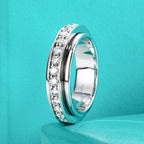 Moissanite spinner ring, side profile, outer band rotating on inner band — Aurora Moissanite
