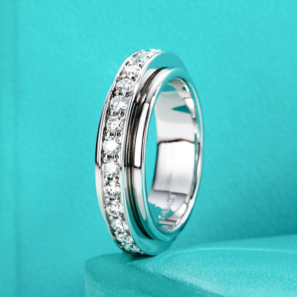 Moissanite spinner ring, side profile, outer band rotating on inner band — Aurora Moissanite