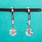 The Aura Earrings — 2cttw moissanite drop studs, front view — Aurora Moissanite
