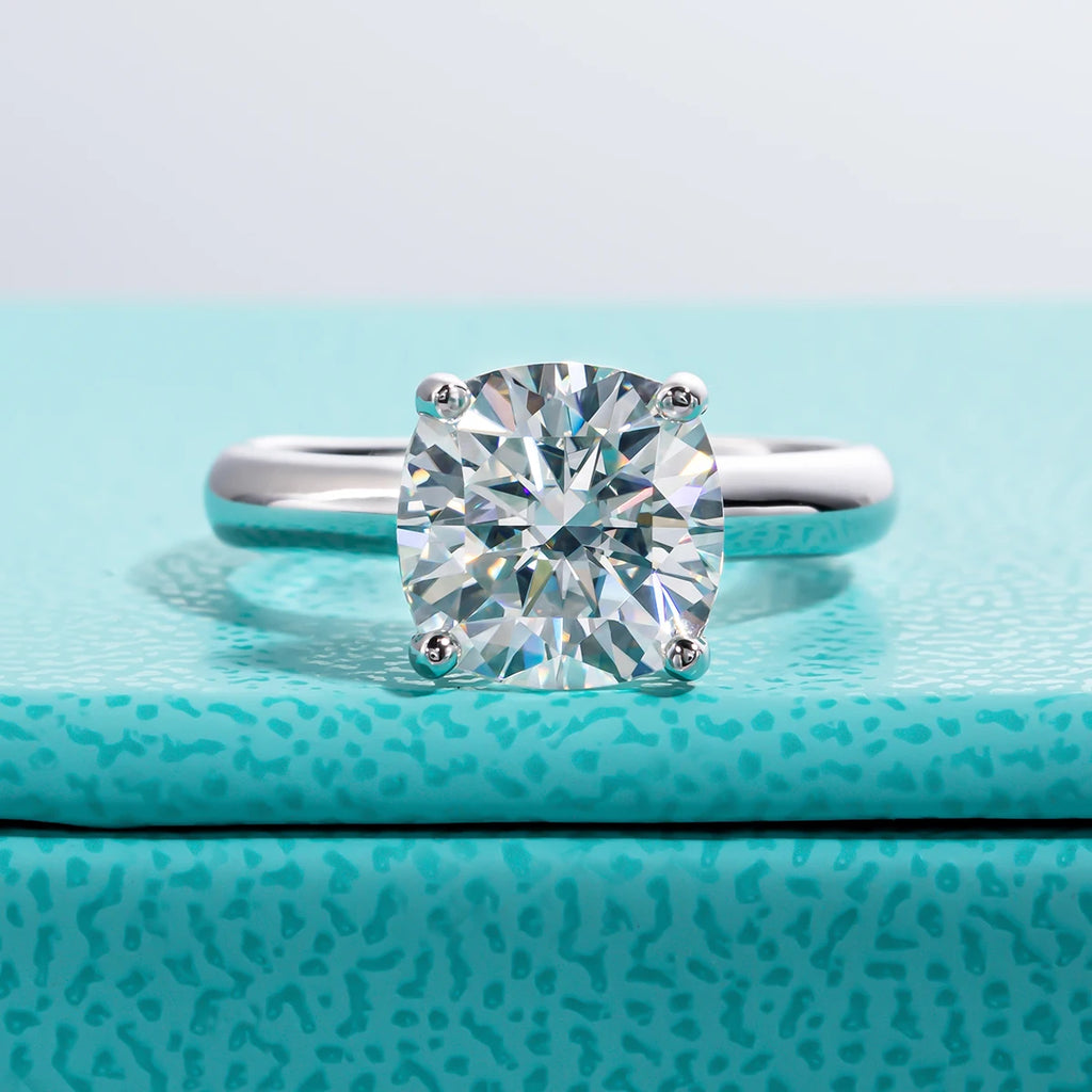 The Neve Ring worn — 3.5ct cushion gray moissanite solitaire engagement ring — Aurora Moissanite