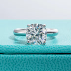 The Neve Ring worn — 3.5ct cushion gray moissanite solitaire engagement ring — Aurora Moissanite