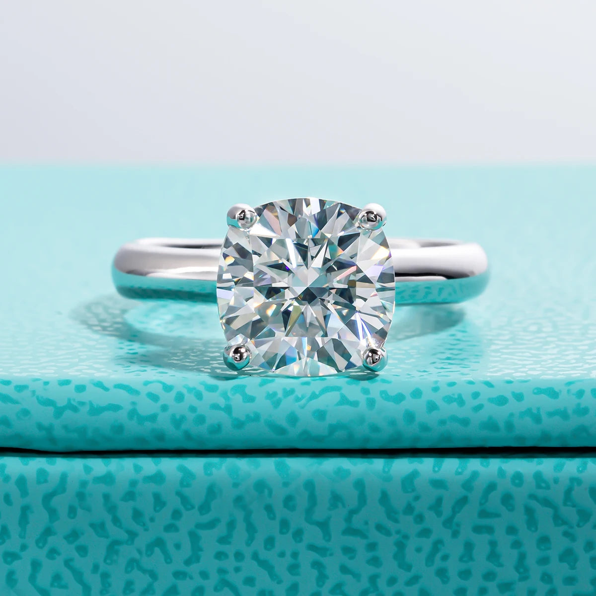 The Neve Ring worn — 3.5ct cushion gray moissanite solitaire engagement ring — Aurora Moissanite