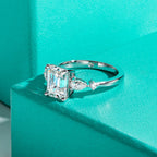 The Vale Ring — emerald and pear moissanite two-stone, front view — Aurora Moissanite