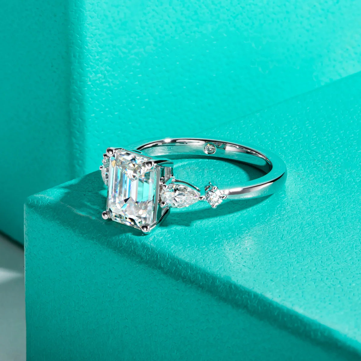 The Vale Ring — emerald and pear moissanite two-stone, front view — Aurora Moissanite