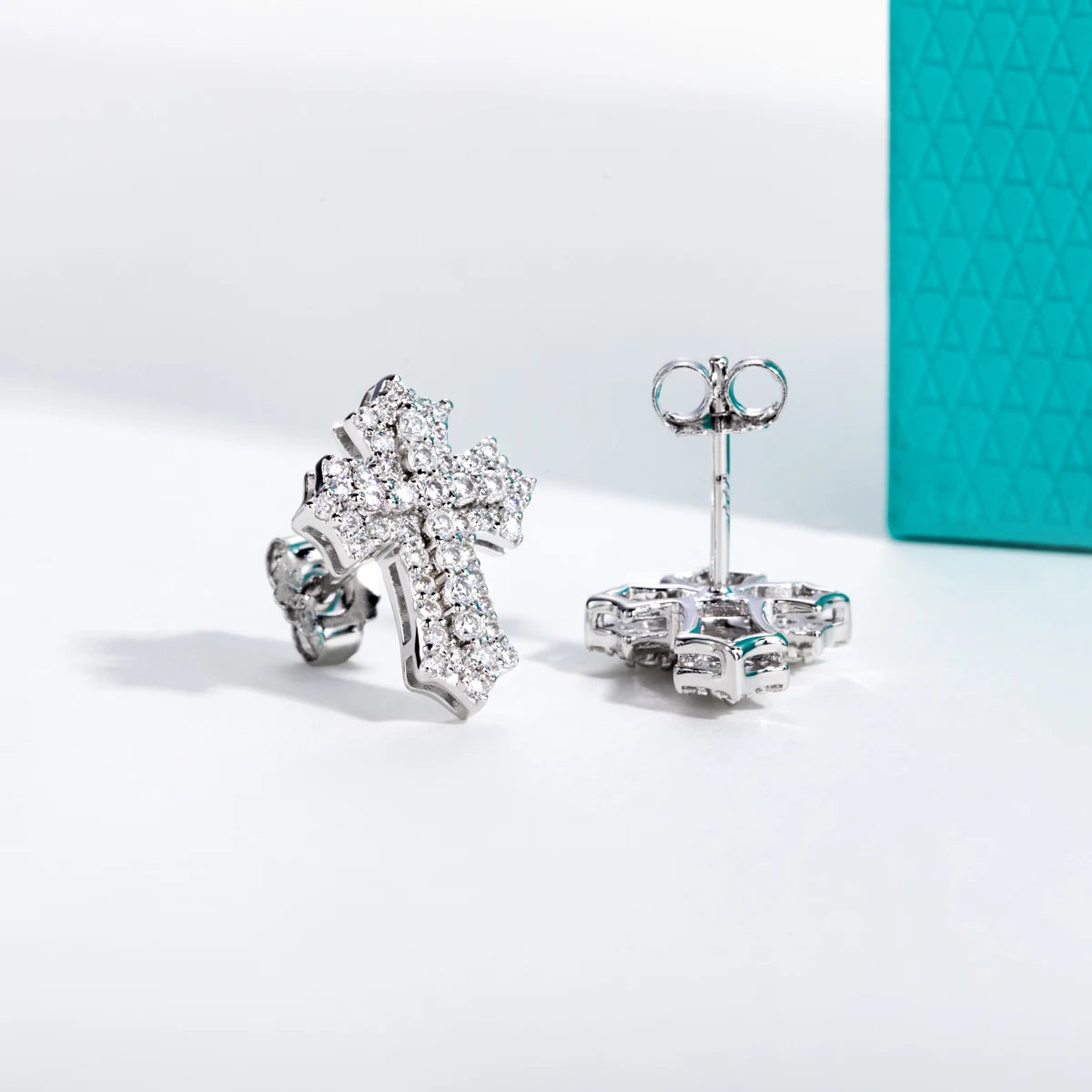 The Noir Earrings — 0.78cttw iced cross studs, front — Aurora Moissanite