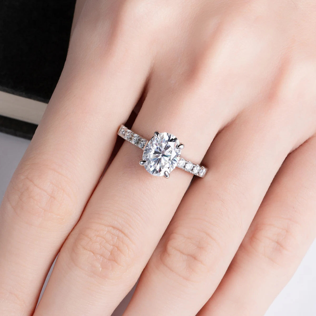 Oval moissanite top view, 3ct D color in prong setting — Aurora Moissanite