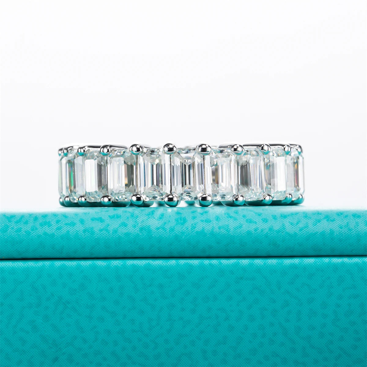 The Ember Band — emerald cut moissanite full eternity ring, front view — Aurora Moissanite