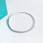 The Lace Bracelet lifestyle — 3mm moissanite bangle worn on wrist — Aurora Moissanite