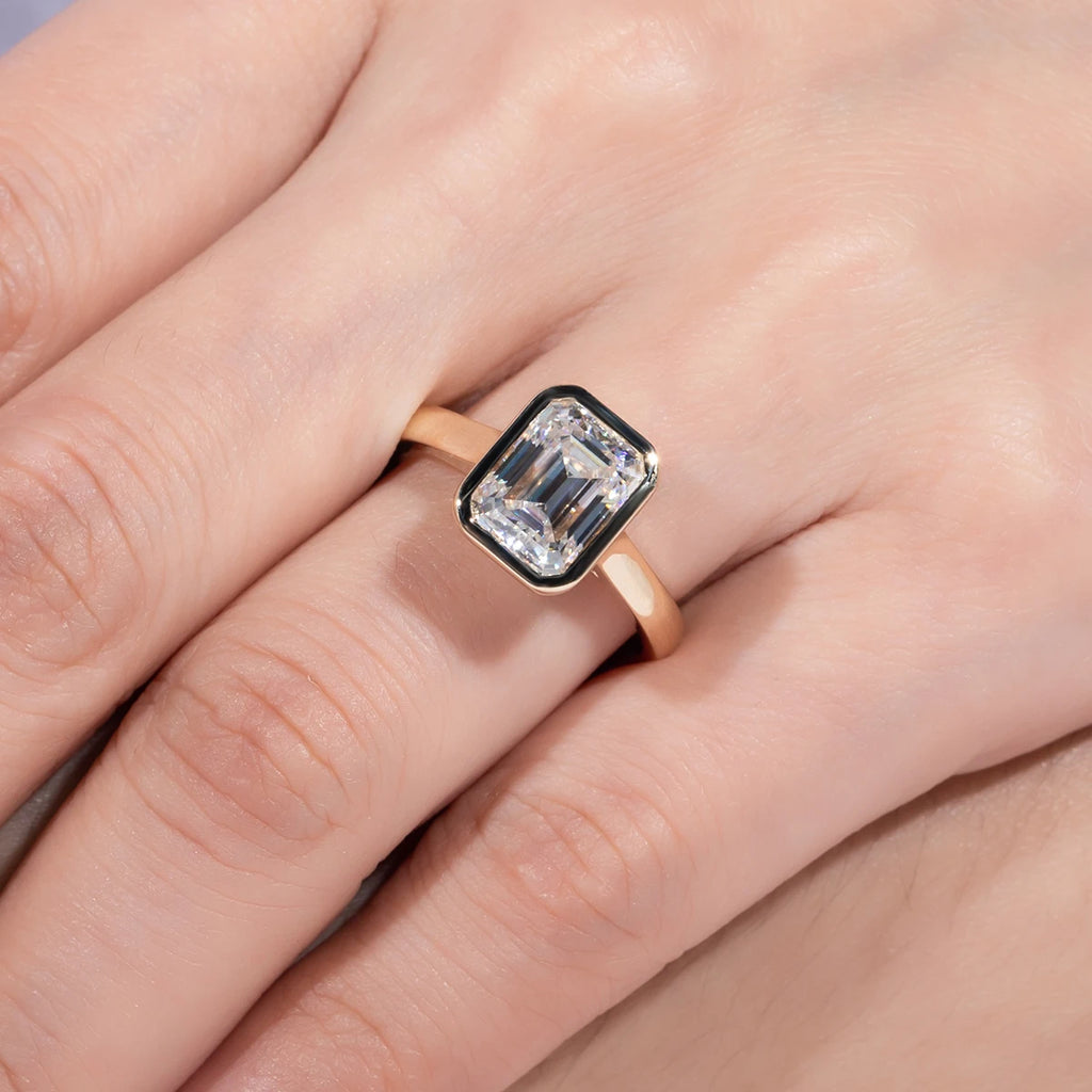 Emerald moissanite bezel top view, rectangular stone in yellow gold rim — Aurora Moissanite
