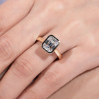 Emerald moissanite bezel top view, rectangular stone in yellow gold rim — Aurora Moissanite