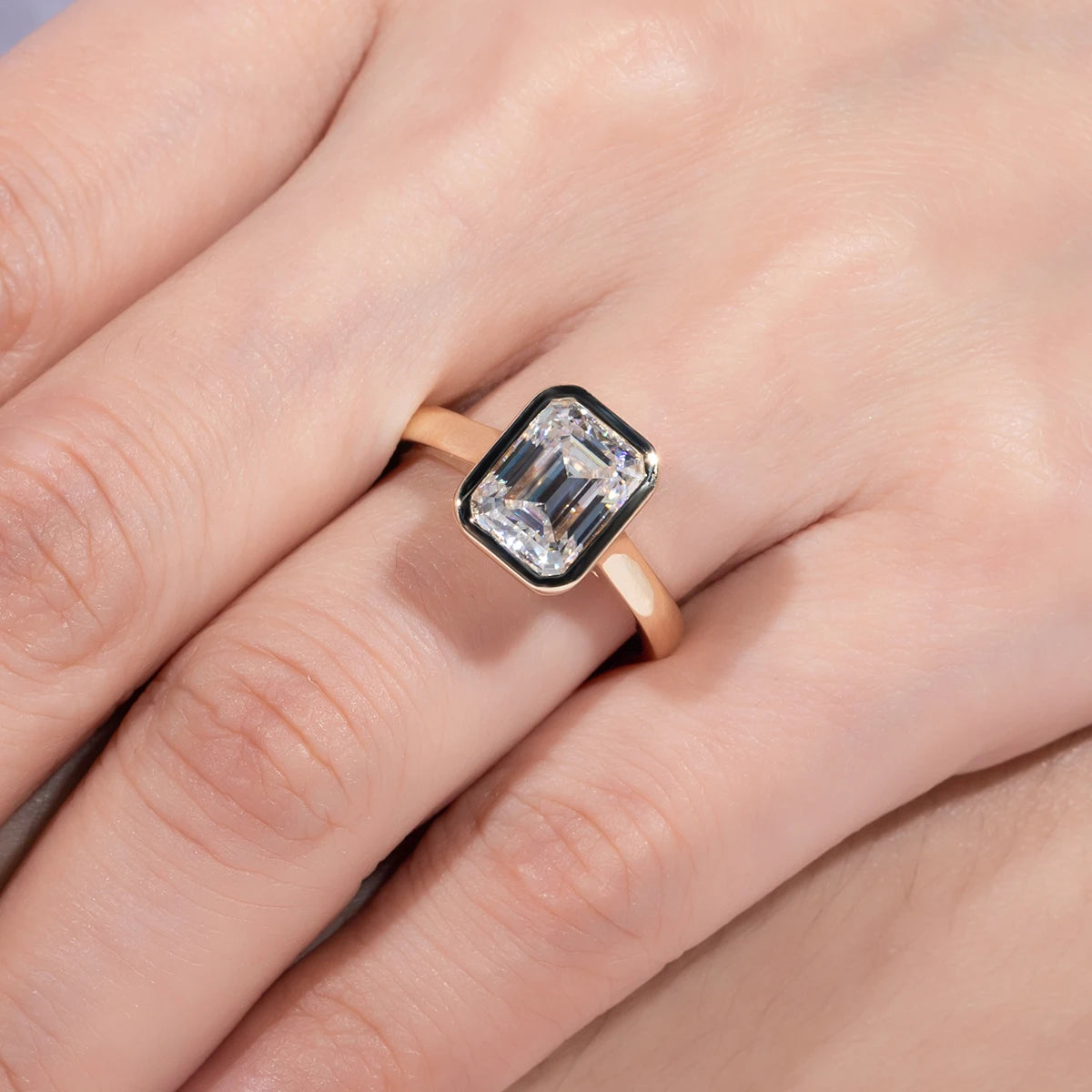 Emerald moissanite bezel top view, rectangular stone in yellow gold rim — Aurora Moissanite
