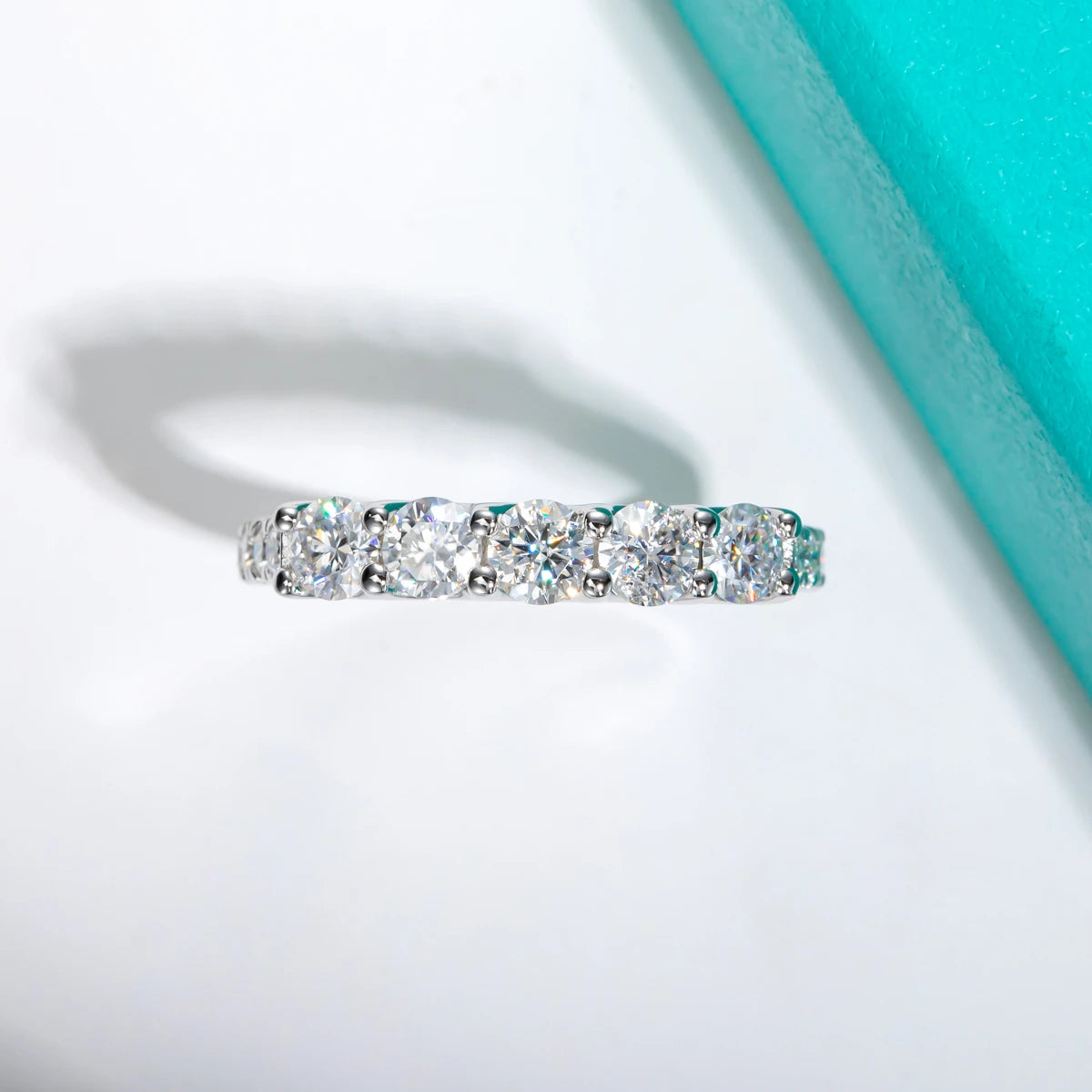 The Wave Band lifestyle — moissanite 5-stone ring worn on finger — Aurora Moissanite