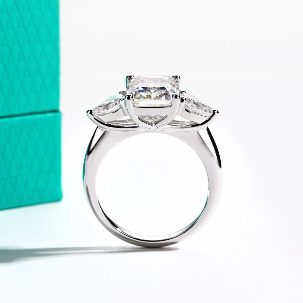Emerald cut moissanite 4ct with pear 0.5ct D color VVS1, two-stone detail — Aurora Moissanite