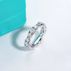 Moissanite eternity band D color VVS1 round stones, continuous prong setting — Aurora Moissanite