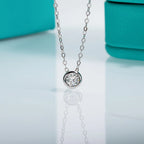 Round moissanite 0.3ct D color pendant, black gun plated setting detail — Aurora Moissanite