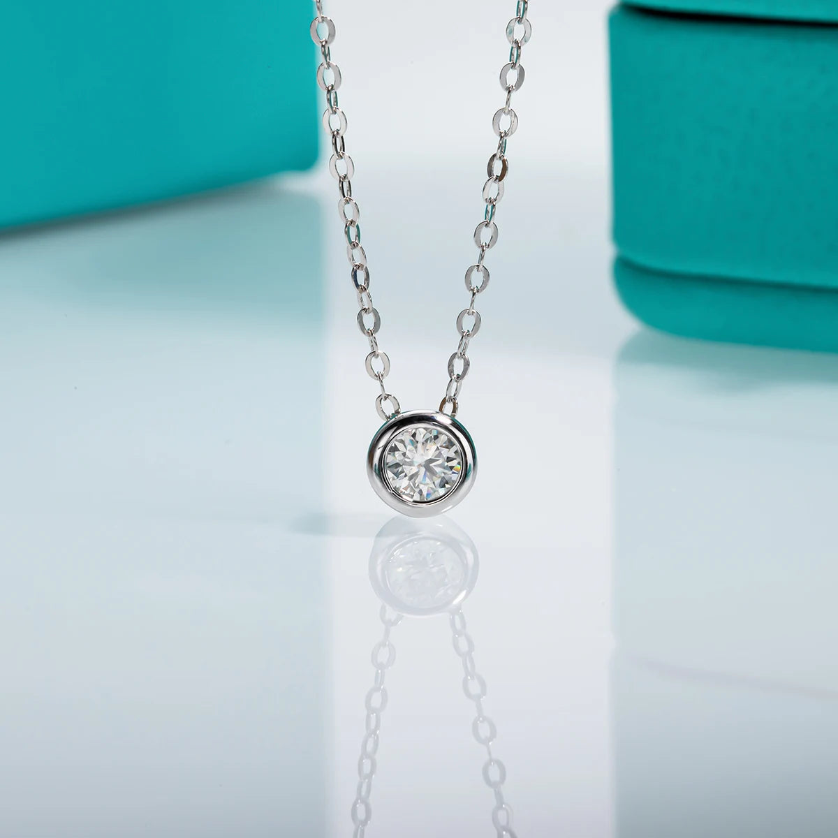 Round moissanite 0.3ct D color pendant, black gun plated setting detail — Aurora Moissanite