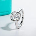 The Vera Ring worn — 3ct cushion cut moissanite bezel engagement ring — Aurora Moissanite
