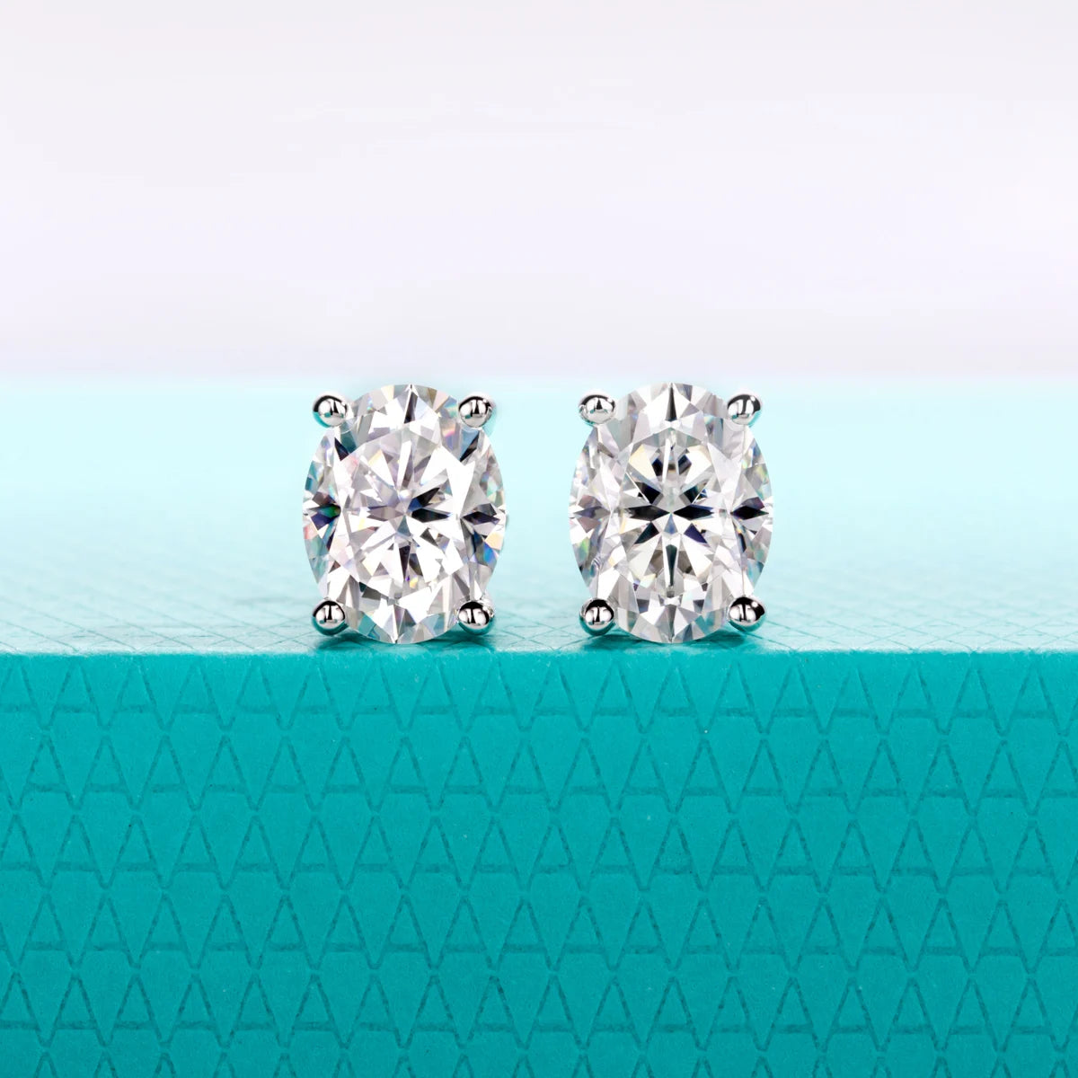 The Lume Earrings — cushion and oval moissanite stud options, 0.5ct to 3ct — Aurora Moissanite