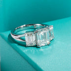 The Alva Ring — 5cttw emerald three-stone moissanite, front view — Aurora Moissanite