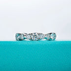 The Cirra Band — moissanite full eternity ring, front view, 18K white gold — Aurora Moissanite