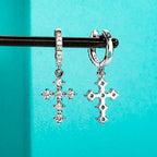 The Kael Earrings — moissanite cross huggie hoops, front view — Aurora Moissanite
