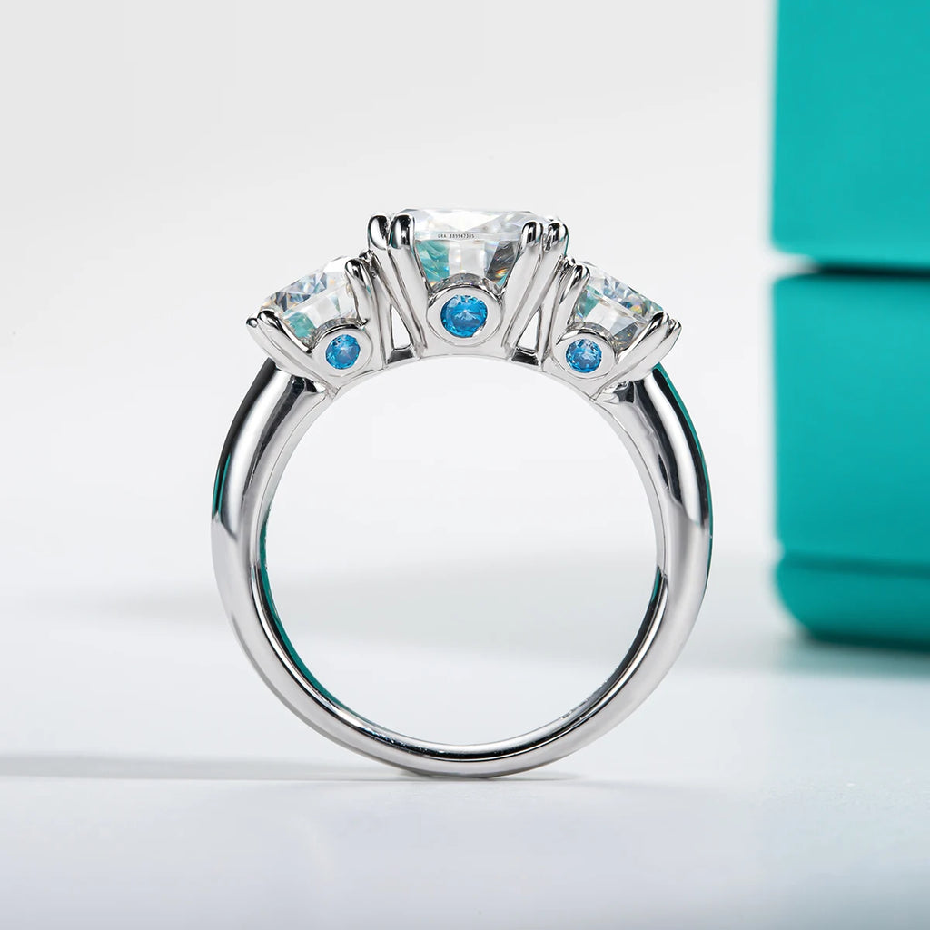 5cttw three stone moissanite ring, side profile, 18K gold plated — Aurora Moissanite