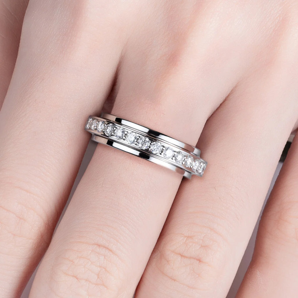 Moissanite spinner band top view showing full eternity stones on outer ring — Aurora Moissanite