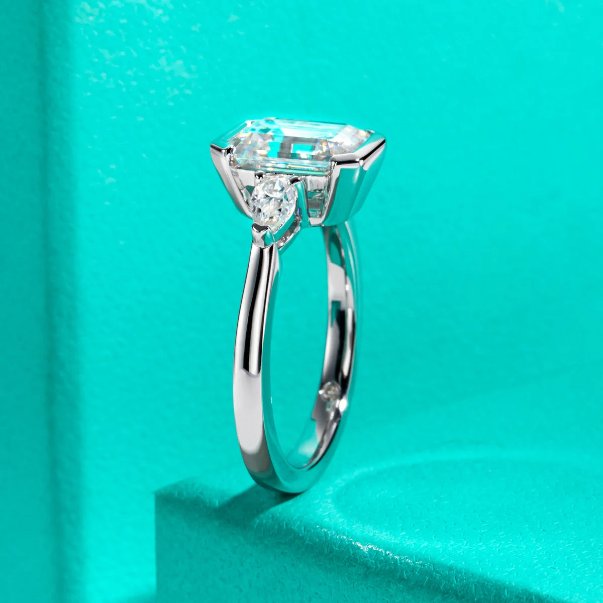 The Deia Ring — emerald pear moissanite channel setting, front view — Aurora Moissanite